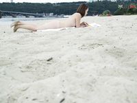 Nymphs dressing and undresing on strand