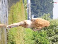 Topless by the Lake Shore in a Green Bead Necklace