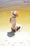 Topless by the Lake Shore in a Green Bead Necklace