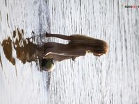 Topless by the Lake Shore in a Green Bead Necklace