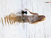 Topless by the Lake Shore in a Green Bead Necklace