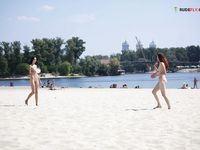 toying with her honeypot on a public strand