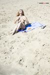 River Shallows Hold Three Nude Friends Under Summer Sun