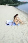 River Shallows Hold Three Nude Friends Under Summer Sun