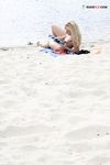 River Shallows Hold Three Nude Friends Under Summer Sun