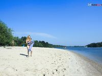 River Shallows Hold Three Nude Friends Under Summer Sun