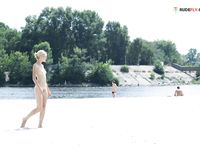 Greasing boobies on the plage before sunbath...