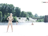 Greasing boobies on the plage before sunbath...