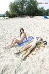 Lost in a Russian Paperback on a Sandy Nude Beach Towel