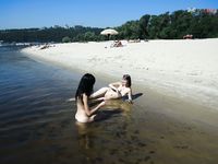 Lost in a Russian Paperback on a Sandy Nude Beach Towel