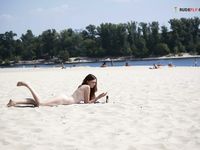 Cute female wearing at strand only a cowboy hat