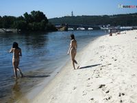 Cute female wearing at strand only a cowboy hat