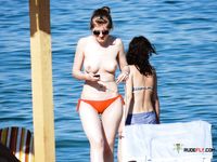 Amateur beach mom in nudist colony is all alone as she enters the water to refresh before getting back on the beach to suck off her husband