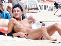 MILF at a nudist resort enjoys the sun for a bit