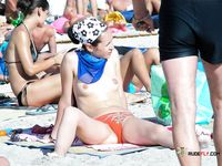 She goes out swimming, with her firm ass flashing, before her girlfriend with a smooth, shaved pussy joins the fun 2