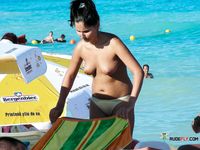 While she smokes the cigarette, everyone at the beach can't stop starring at her tits