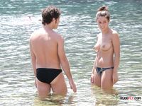 Beautiful brunette cuties with slim bodies and perky tits enjoy a sunny day at the beach sunbathing