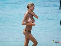 She shows off her perfect ass and her soft, smooth, shaved pussy before being drilled by her boyfriend at the beach