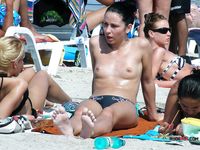 Two voluptuous sluts hang out on a naked beach while they talk about what they did last night and are they planning to do tonight