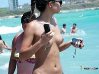 Two voluptuous sluts hang out on a naked beach while they talk about what they did last night and are they planning to do tonight