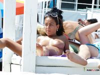 Striped Bikini Bottoms During a Calm Sandy Beach Sunbathe