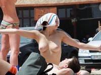 Sexy cuties with slim bodies and perky tits sit and sunbathe or walk around the beach