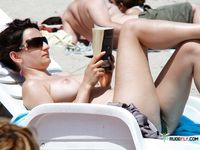 Sexy cuties with slim bodies and perky tits sit and sunbathe or walk around the beach