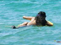 And then, she uses the sun cream to rub her sweet shoulders gently, and to rub her boobies, of course