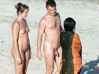 Sensual naturist blonde wife relaxes at the beach completely naked