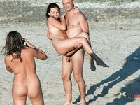 Sensual naturist blonde wife relaxes at the beach completely naked