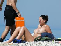 One hot milf and one young teen are sunbathing while we watch them 2