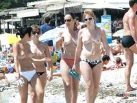The lie topless outdoors, with their beautiful, perky tits on display