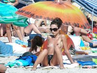 Nudist family caught on camera having fun at the beach