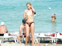 This skinny young cutie enjoys the water and walks around topless, showing off her perfect, young breasts