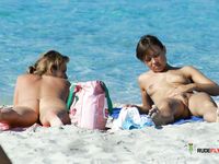 Stunning young brunette naturist secretly filmed topless by a voyeur