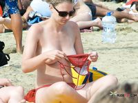 She smokes standing, with her perfect, firm butt on display and her cute, perky tits barely showing