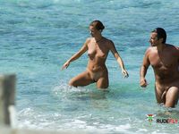 Standing Bare in the Clear Calm Waters of the Beach