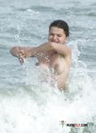 Cool Waves Around Her on a Topless Beach Day