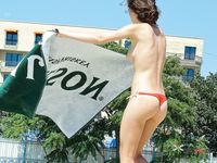 Young and beautiful nudist brunette caught on a hidden cam relaxing by the sea