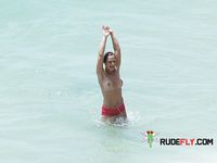 Topless slim hotties take turns showering with their perfect breasts on display 2