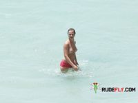 Topless slim hotties take turns showering with their perfect breasts on display 2