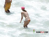 Topless slim hotties take turns showering with their perfect breasts on display 2