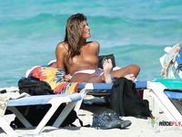 Slim nudist brunettes filmed by a voyeur getting ready to leave the beach