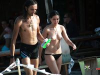 Topless Walk Across a Crowded Sandy Beach