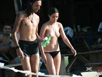 Topless Walk Across a Crowded Sandy Beach