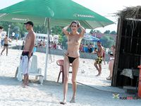 Topless Sunbathing With a Single Beach Earring