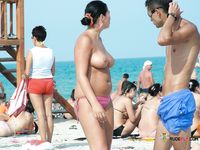 Topless Sunbathing With a Single Beach Earring