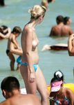 Now she likes to be a nudist who drinks alcohol and smokes at the beach 3