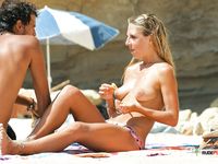 Reclining on Sandy Nude Beach in Oval Sunglasses