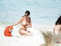 Curvy naturist MILFs filmed with a hidden camera naked at the beach